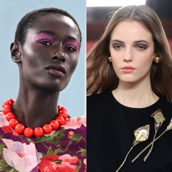 Two models with bold eye shadow cover their entire lids